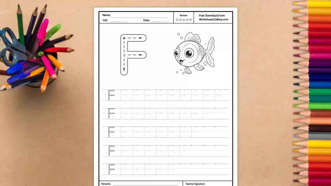 A white worksheet for tracing the uppercase letter F, featuring a large outlined 'F' with dotted lines and directional arrows, next to a cute cartoon fish illustration. The worksheet is surr