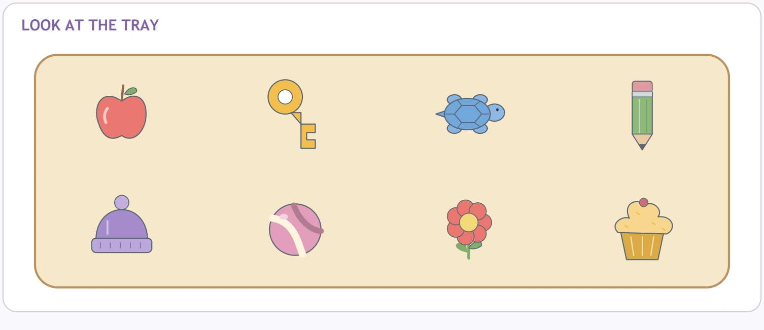 Teddy Tray Recall — eight-picture reference tray Apple, key, turtle, pencil, hat, ball, flower and cupcake fill two tray rows.